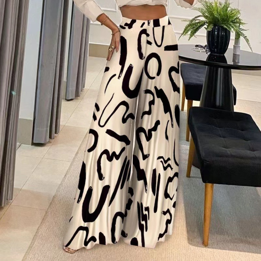 LeRoxy | Damesbroek met wijde pijpen en artistieke print | Comfortabele high-waist pasvorm